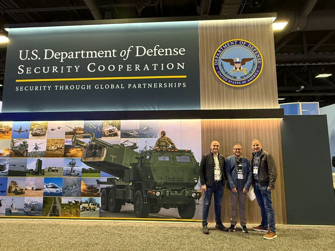 Team members at a U.S. defense technology conference